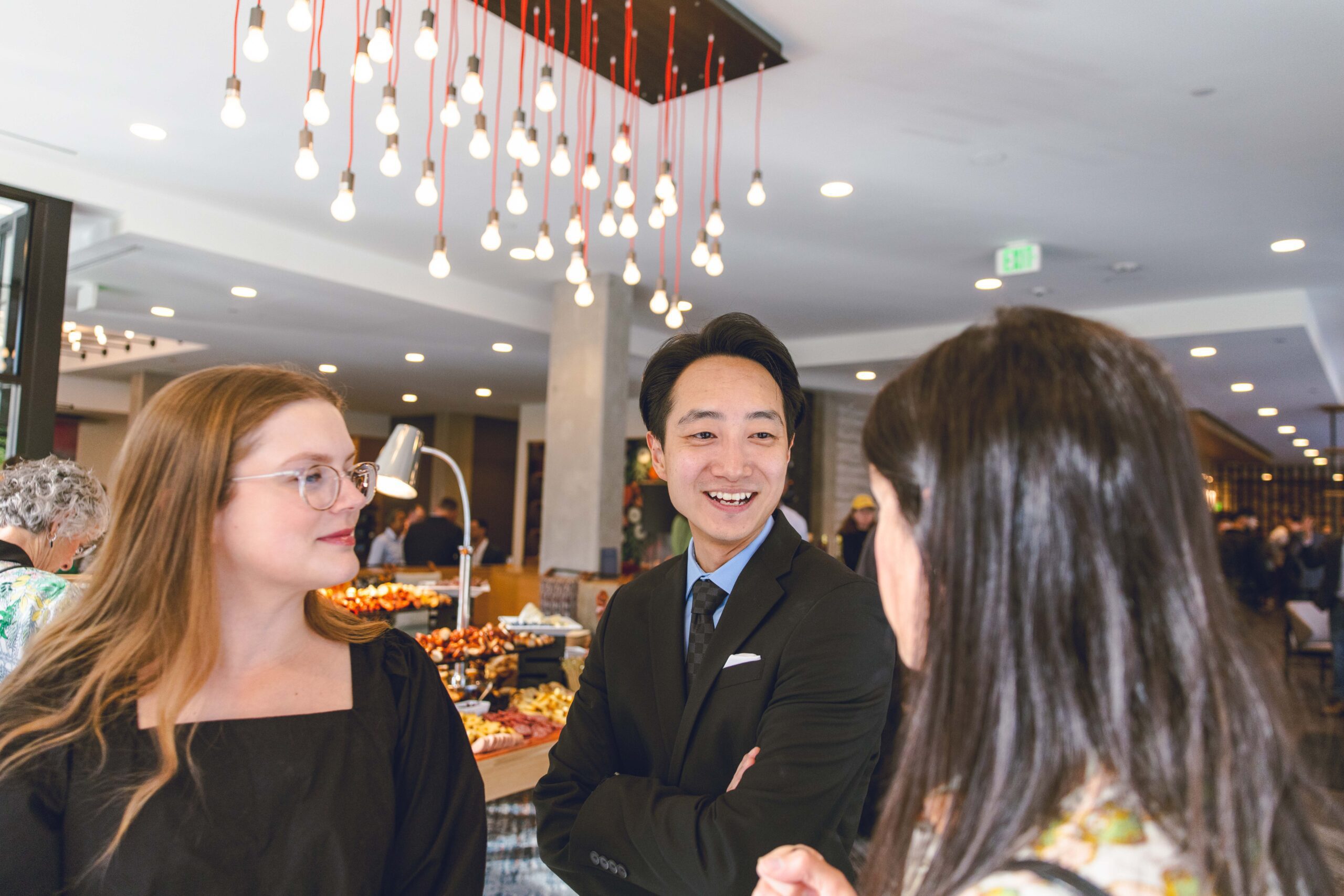 Manager speaking to smiling guests
